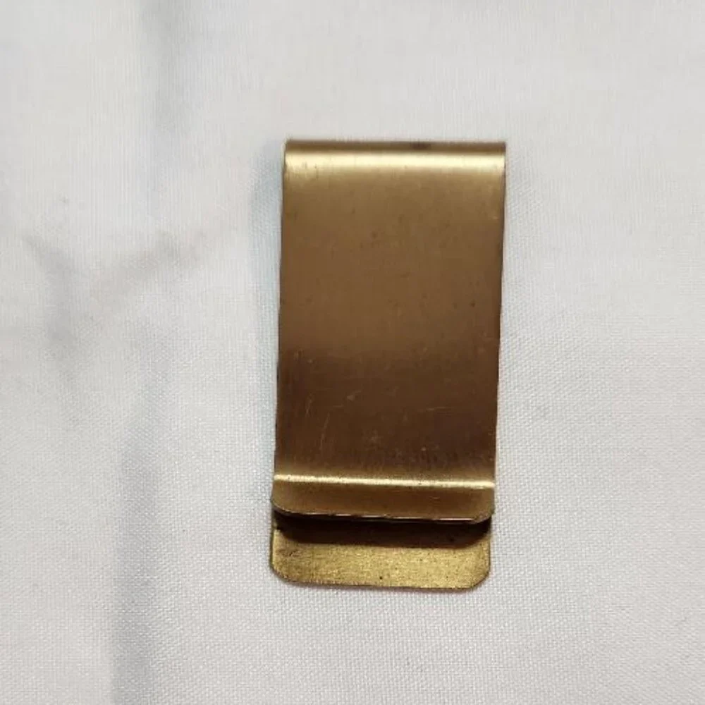 Vintage Brass Money Clip with a treble clef design